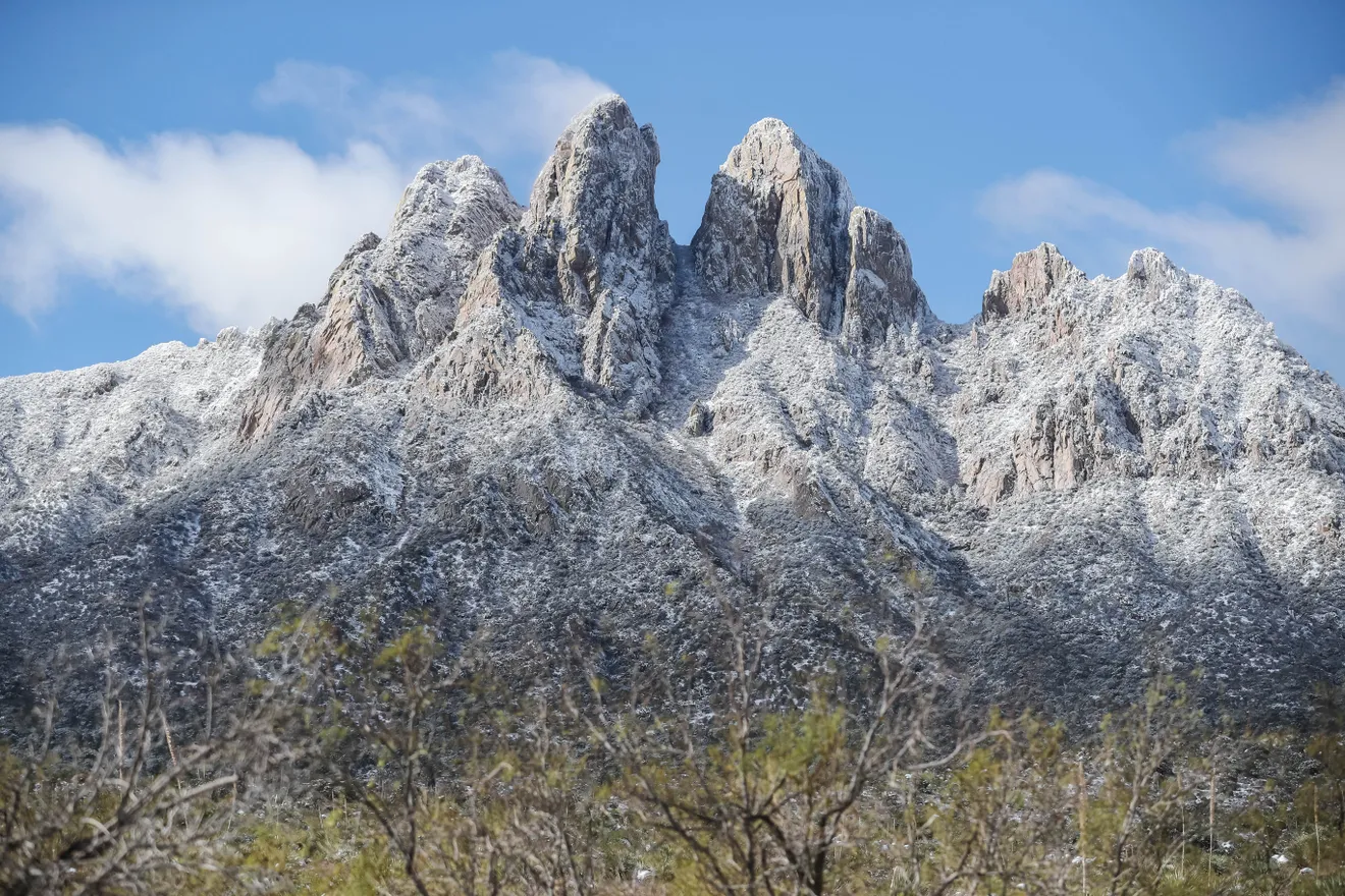 A snow covered mountain peak