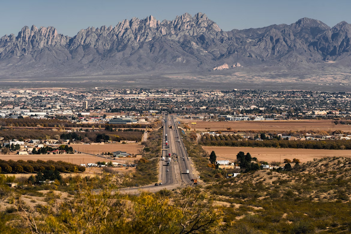 A road with a mountain in the background